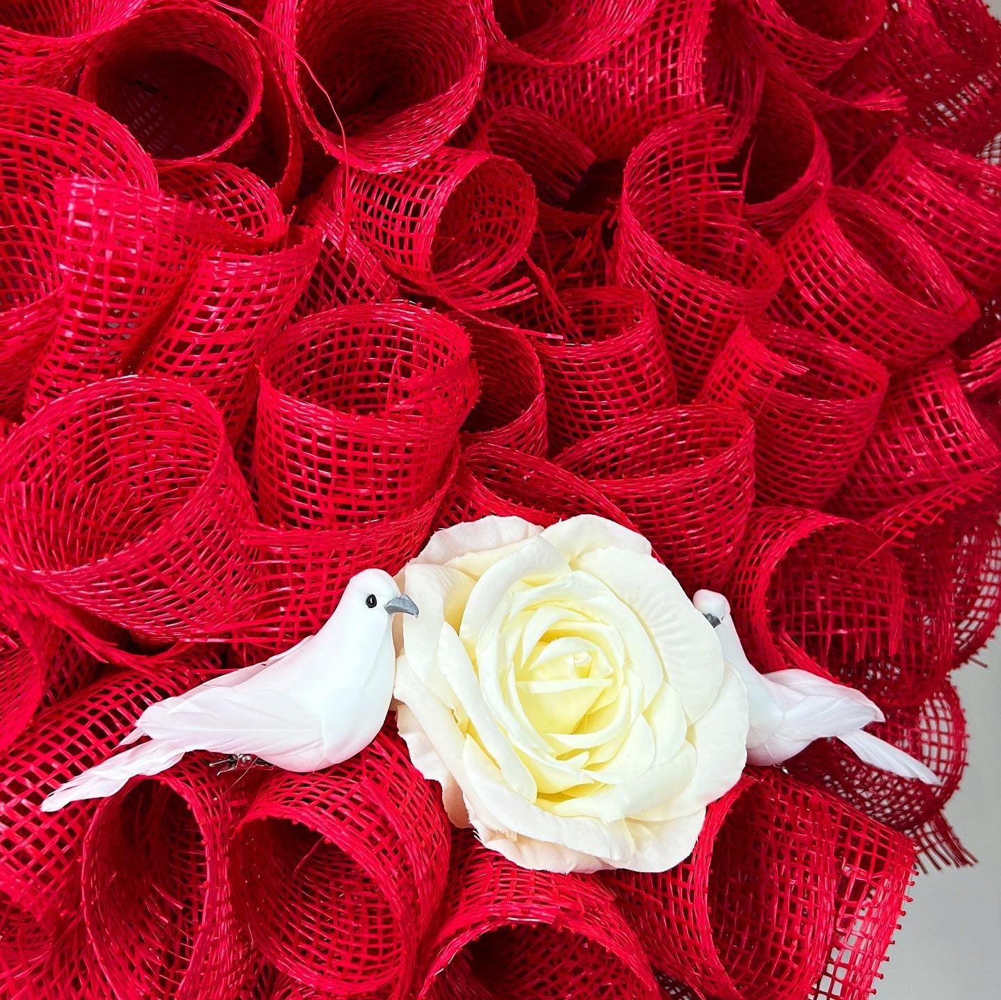 Heart shaped wreath with rose and birds