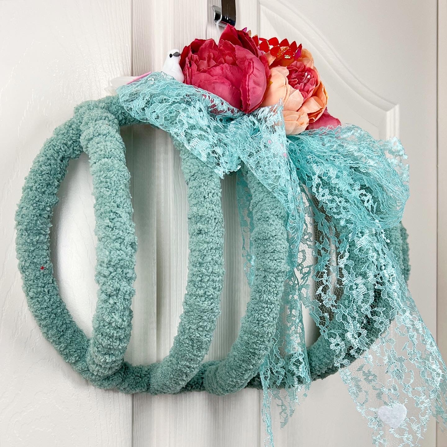 Romantic wreath with flowers and birds