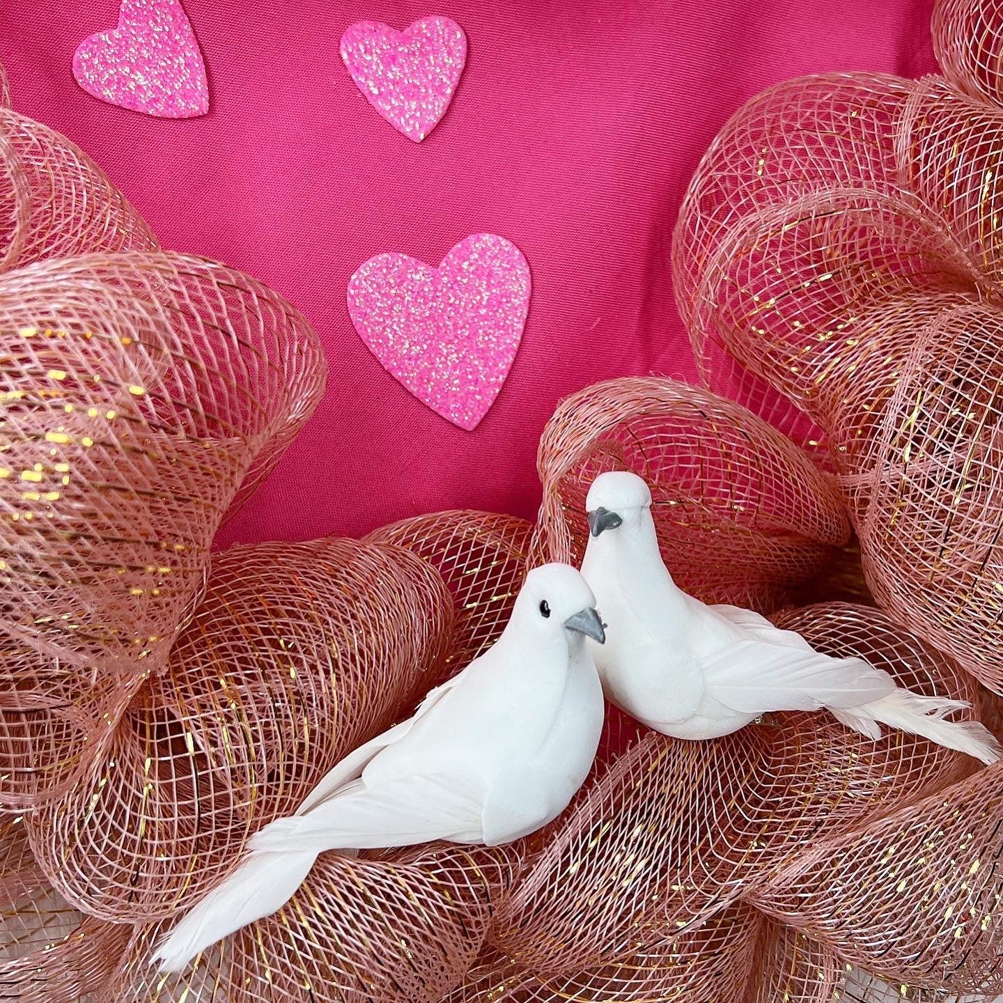 Romantic pink heart shaped wreath with birds