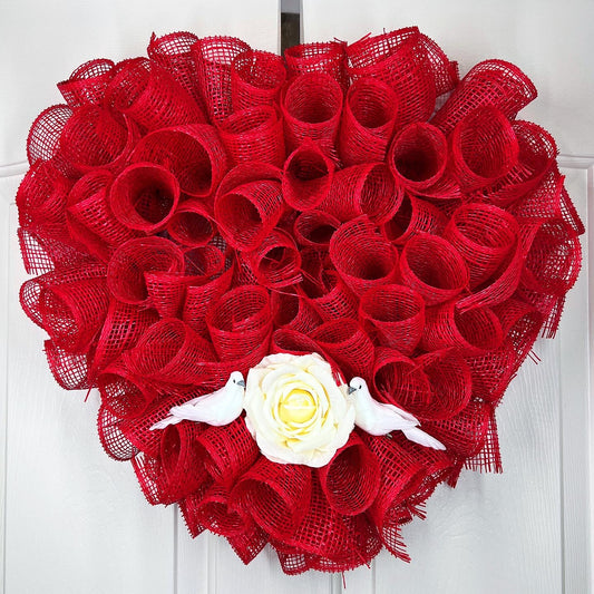 Heart shaped wreath with rose and birds