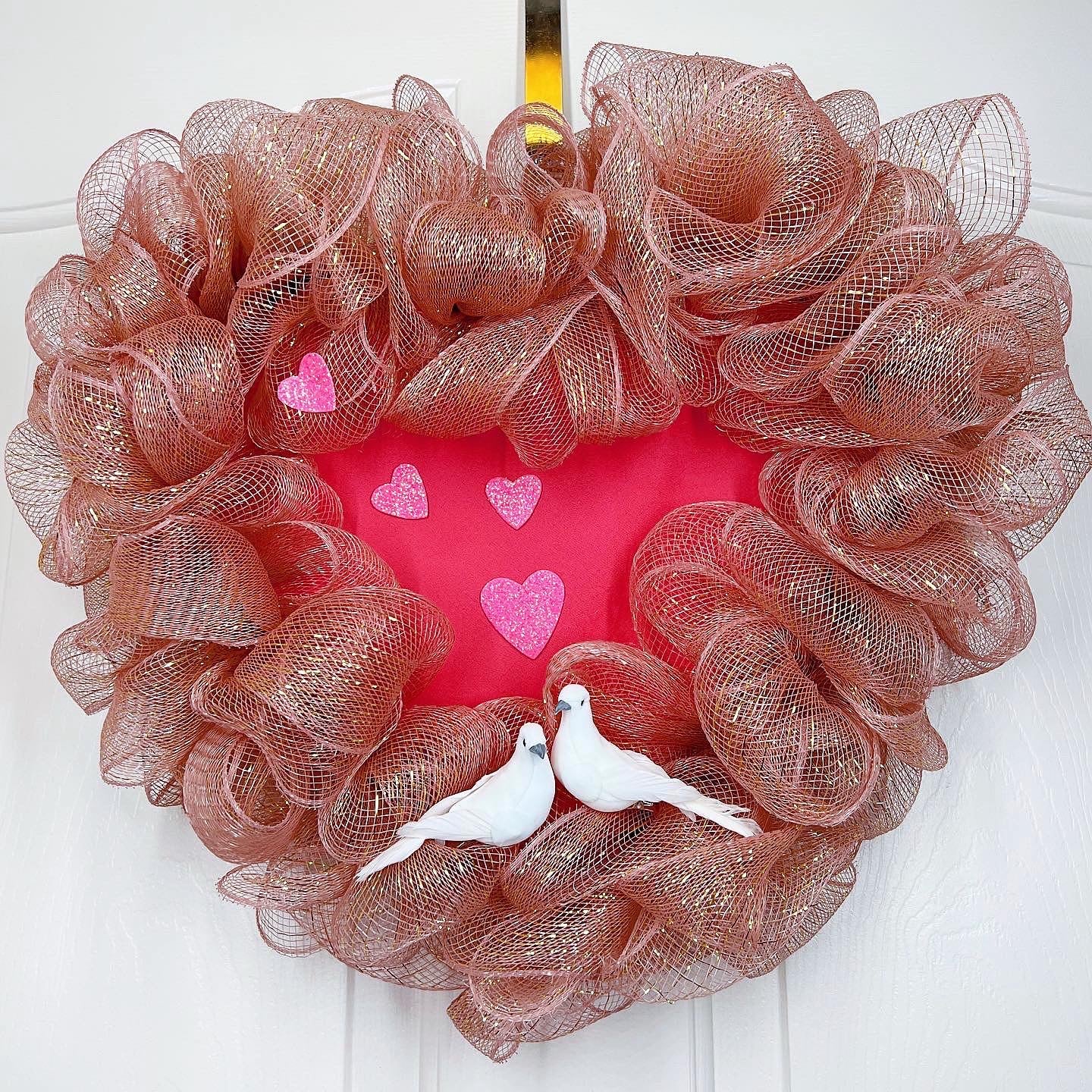 Romantic pink heart shaped wreath with birds
