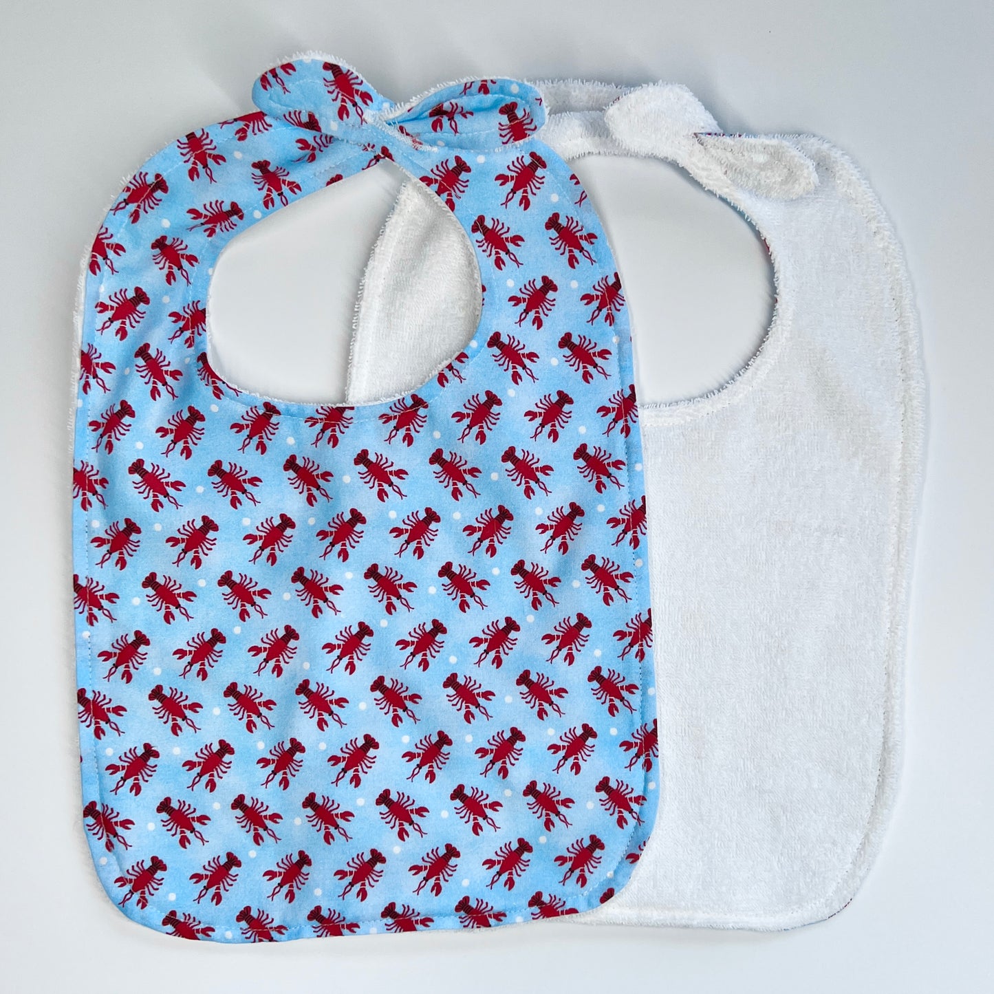 Square baby bib with reversible towel side "Lobsters"